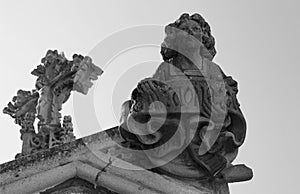 Male figure with christ on the cross behind photo