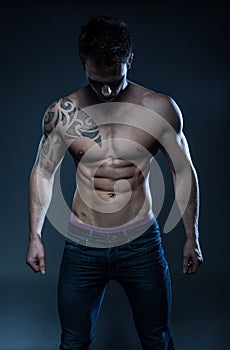 Male fitness model with the tattoo