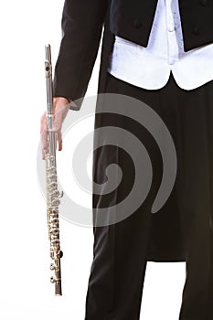 Male flutist wearing tailcoat holds flute