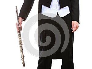 Male flutist wearing tailcoat holds flute