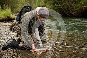 male fly fishing angler arctic char alaska