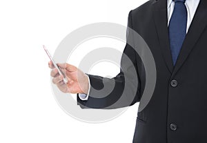 Male in formalwear standing in front of white background holding mobile phone in hand