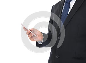 Male in formalwear standing in front of white background holding mobile phone in hand