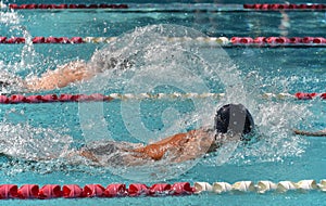 Male freestyle swimmers in a close race