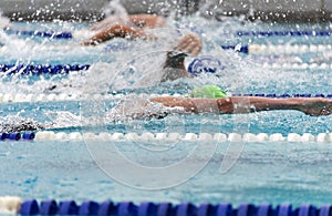 Male freestyle swimmers in a close race