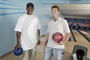 Male Friends At Bowling Alley