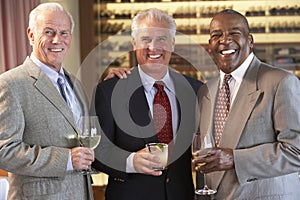 Male Friends Socializing At A Bar photo