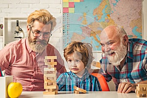 Male generations friendship. Laughing grandparent with son and grandchild relaxing spending weekend at home. Playing