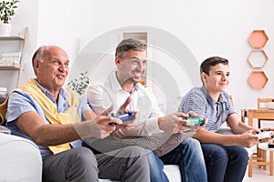 Male generations playing game together