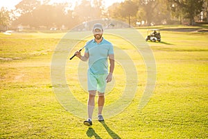 male golf player on professional course walk on green grass, golfing