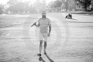 male golf player on professional course walk on green grass, golfing