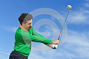 Male Golf Swing on a beautiful day