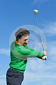 Male Golf Swing on a beautiful day