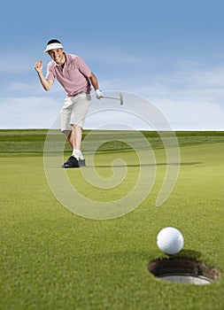 Male Golfer Cheering While Playing Golf