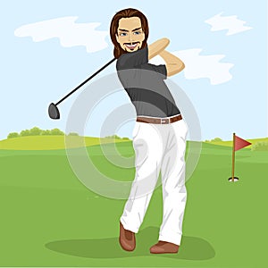 Male golfer hitting golf shot with club on course