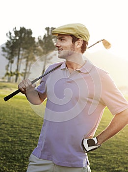 Male Golfer Holding Club On Golf Course