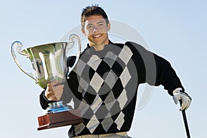 Male Golfer Holding Trophy
