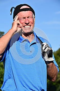 Male Golfer Making A Decision With Golf Club Golfing