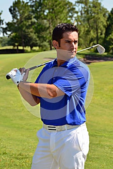 Male Golfer Poses With Golf Club