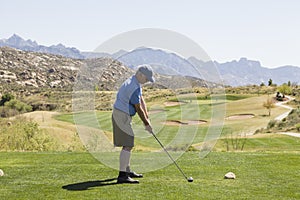 Male golfer at tee off