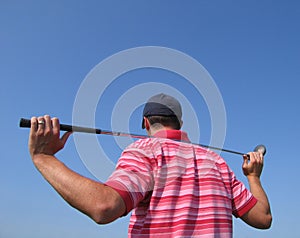 Male Golfer Tees Off