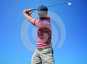 Male Golfer Tees Off