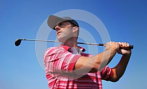 Male Golfer Tees Off