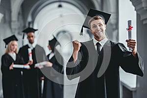 Male graduate in university photo