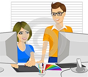 Male graphic designer partner helping his female colleague how to work with a graphic tablet