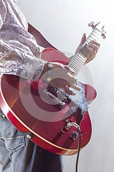 Male Guitar Player Performing with Electric Guitar Hands Closeup