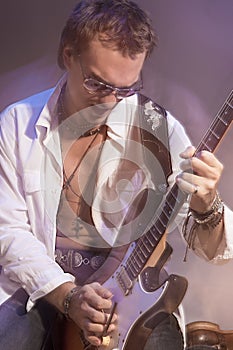 Male Guitarist Playing the Electric Guitar. Shot with Strobes an