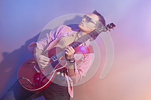 Male Guitarist Playing the Electric Guitar. Shot with Strobes an