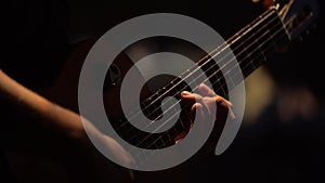 Male guitarist plays the guitar in the dark. Kyiv. Ukraine