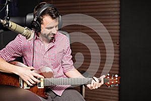 Male guitarist at radio station