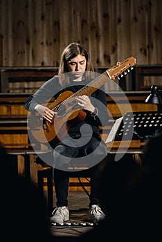 Male guitarist on stage photo