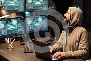 IT male hacker using computer to break system