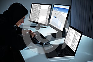 Male Hacker Using Computers