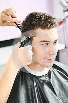 Male hairdresser at work