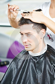 Male hairdresser at work