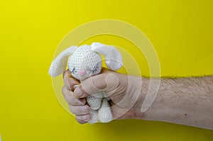 Male hand on a bright background