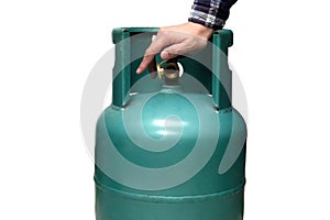 Male hand is closing the valve of lpg gas tank for safety. Files can use clipping parts