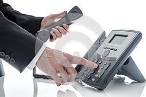 Male hand dialing number