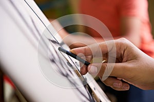 Male Hand Drawing Young Man Sketching Artist Training At School photo