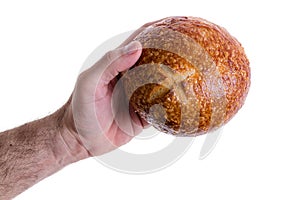 Male hand giving a sourdough bread roll