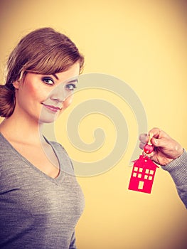 Male hand giving woman house key