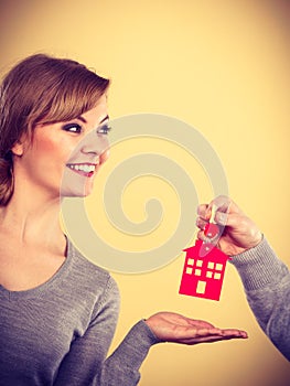 Male hand giving woman house key