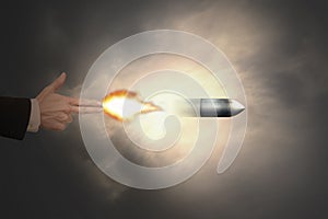 Male hand of gun gesture with firelight shooting bullet