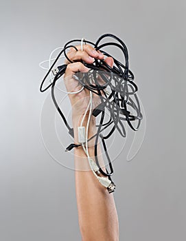 Male hand hold group of cable cords