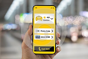 male hand hold phone with application call taxi on screen