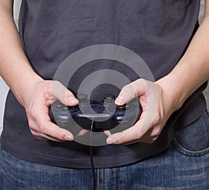 Male hand hold video game controller